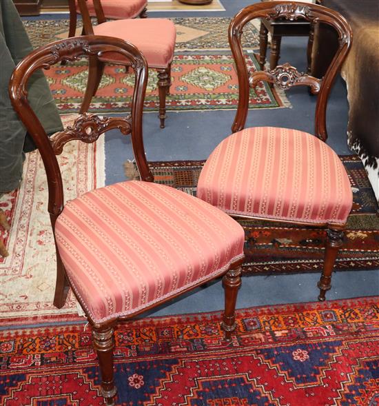 A set of eleven Victorian mahogany balloon back dining chairs, on cabriole legs